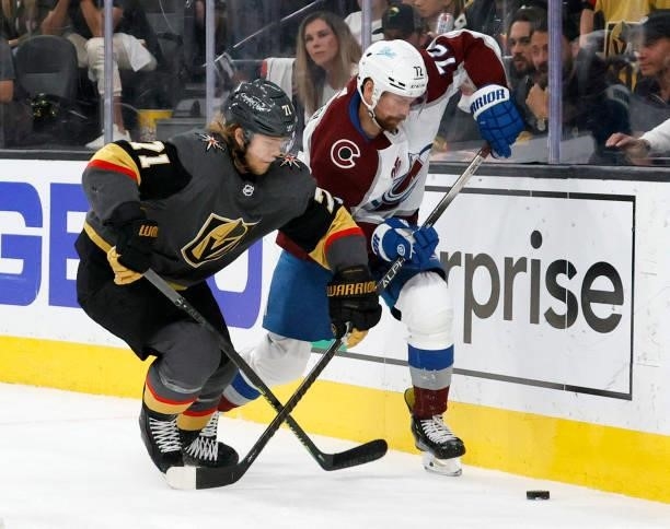 William Karlsson of the Vegas Golden Knights and Joonas Donskoi of the Colorado Avalanche fight for the puck in the third period in Game Six of the...