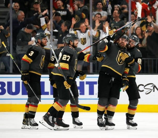 Brayden McNabb, Shea Theodore, William Carrier and Alex Tuch of the Vegas Golden Knights celebrate Carrier's third-period goal against the Colorado...