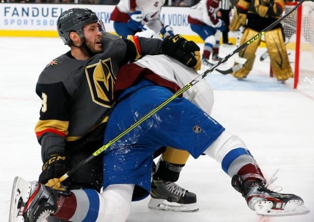 Brayden McNabb of the Vegas Golden Knights gets tangled up with Conor Timmins of the Colorado Avalanche in the third period in Game Six of the Second...