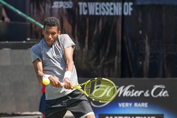 Felix Auger-Aliassime of Canada plays a backhand during his match against Ugo Humbert of France during day 5 of the MercedesCup at Tennisclub...