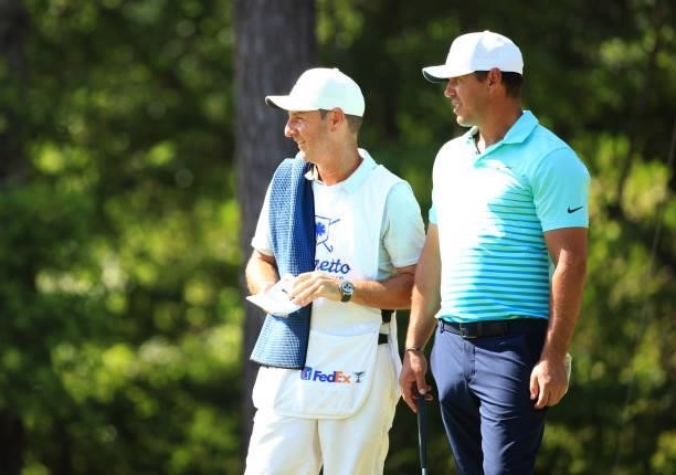 Brooks Kopeka and caddie Ricky Elliott wait on the first hole during the second round of the Palmetto Championship at Congaree on June 11, 2021 in...