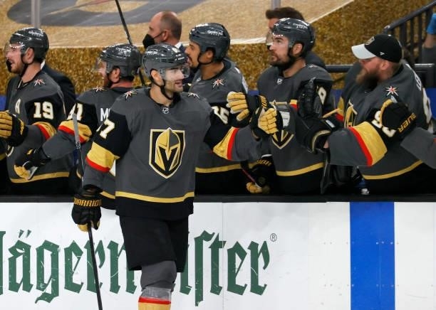 Max Pacioretty of the Vegas Golden Knights celebrates with teammates on the bench after scoring a third-period empty-net goal against the Colorado...