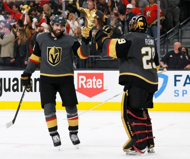 Alex Tuch and Marc-Andre Fleury of the Vegas Golden Knights celebrate a third-period goal by William Carrier against the Colorado Avalanche in Game...