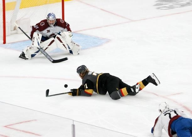 Philipp Grubauer of the Colorado Avalanche defends the net as William Karlsson of the Vegas Golden Knights is tripped by Ryan Graves in the third...