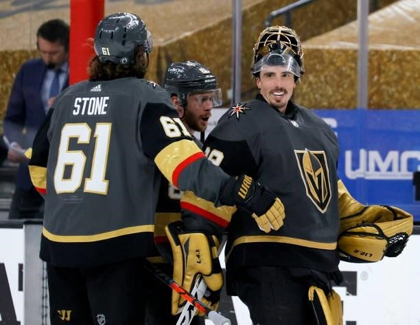 Mark Stone, Jonathan Marchessault and Marc-Andre Fleury of the Vegas Golden Knights celebrate the team's 6-3 victory over the Colorado Avalanche to...