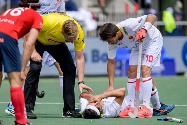 Umpire Coen van Bunge, Enqrique Gonzalez of Spain injured, Marc Salles of Spain during the Euro Hockey Championships match between Spain and France...