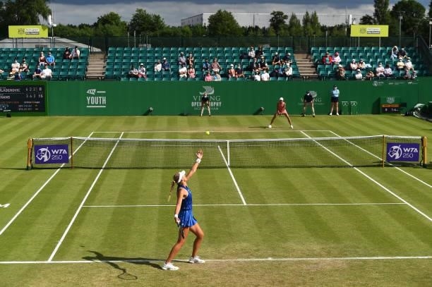 Kristina Mladenovic of France serves to Shuai Zhang of China during the women's singles match on day seven at Nottingham Tennis Centre on June 11,...