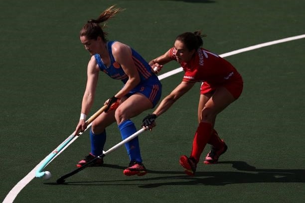 Marloes Keetels of Netherlands battles for the ball with Judith Vandermeiren of Belgium during the Euro Hockey Championships Womens Semi Final match...