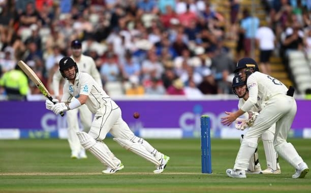 Ross Taylor of New Zealand bats with Ollie Pope and James Bracey of England looking on during day two of the second Test Match at Edgbaston on June...