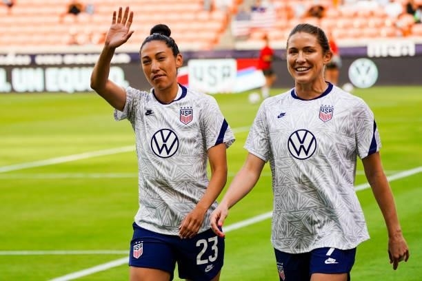 Christen Press of United States and Abby Dahlkemper of United States walk onto the field before the 2021 WNT Summer Series friendly between the...