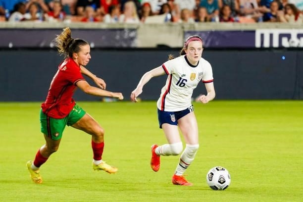 Rose Lavelle of United States dribbles the ball away from Tatiana Pinto of Portugal the 2021 WNT Summer Series friendly between the United States and...