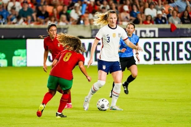 Samantha Mewis of United States dribbles the ball from Andreia Norton of Portugal during the second half the 2021 WNT Summer Series friendly between...