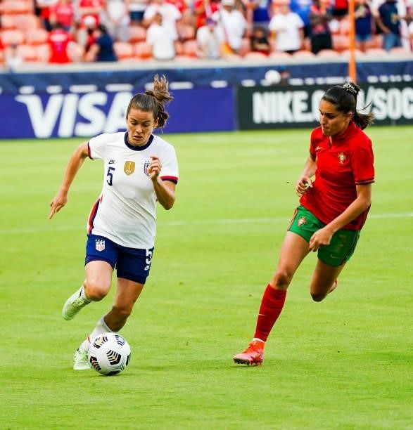 Kelley O'Hara of United States dribbles the ball against Francisca Nazareth of Portugal during the first half of the 2021 WNT Summer Series friendly...