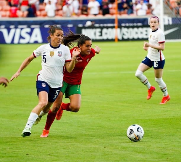 Kelley O'Hara of United States dribbles the ball against Francisca Nazareth of Portugal during the first half of the 2021 WNT Summer Series friendly...