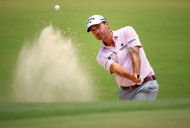 Kevin Kisner plays a shot from a bunker on the first hole during the second round of the Palmetto Championship at Congaree on June 11, 2021 in...