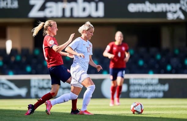 Sophie Schmidt of Canada competes for the ball with Klara Cahynova of Czech Republic during the Women's International friendly match between Canada...