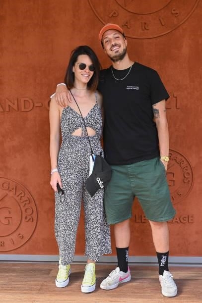 Raphaël Carlier aka Carlito and his wife Erika Fleury attend the French Open 2021 at Roland Garros on June 11, 2021 in Paris, France.