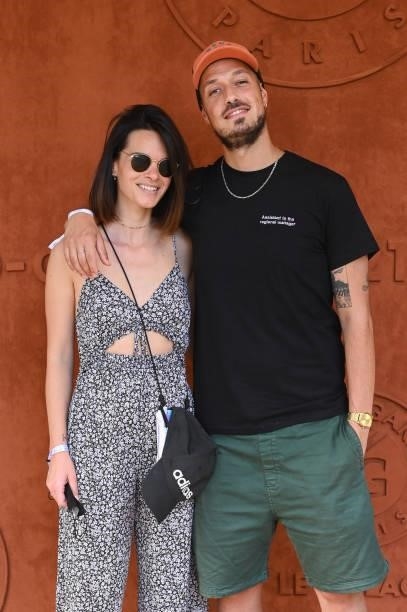 Raphaël Carlier aka Carlito and his wife Erika Fleury attend the French Open 2021 at Roland Garros on June 11, 2021 in Paris, France.