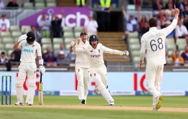 Dan Lawrence of England celebrates taking the wicket of Will Young of New Zealand with team mate James Bracey during day two of the second Test Match...