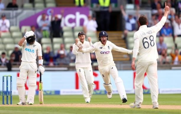 Dan Lawrence of England celebrates taking the wicket of Will Young of New Zealand with team mate James Bracey during day two of the second Test Match...