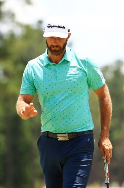 Dustin Johnson reacts to his putt on the first hole during the second round of the Palmetto Championship at Congaree on June 11, 2021 in Ridgeland,...
