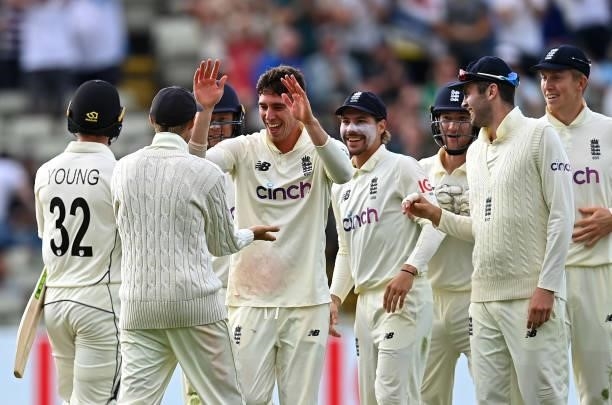Dan Lawrence of England celebrates taking the wicket of Will Young of New Zealand with team mates during day two of the second Test Match at...