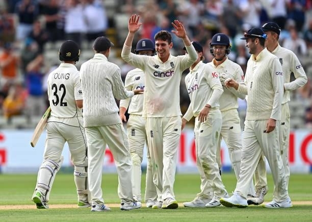 Dan Lawrence of England celebrates taking the wicket of Will Young of New Zealand with team mates during day two of the second Test Match at...