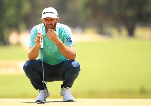 Dustin Johnson lines up a putt on the first green during the second round of the Palmetto Championship at Congaree on June 11, 2021 in Ridgeland,...