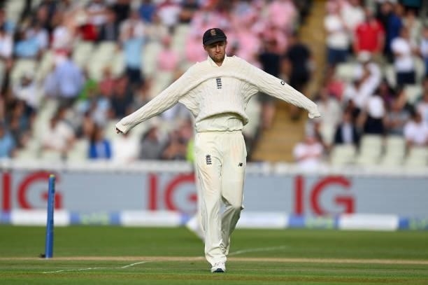 Joe Root of England pulls on a jumper during day two of the second Test Match at Edgbaston on June 11, 2021 in Birmingham, England.