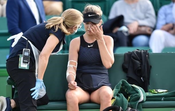 Katie Boulter of Great Britain receives treatment for an injury as she plays against Lauren Davis of United States during the women's singles match...
