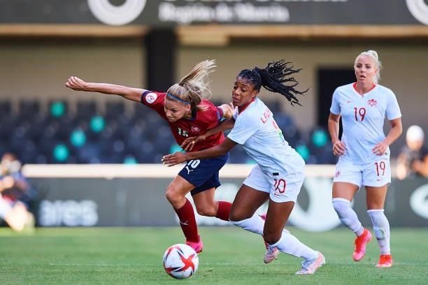 Ashley Lawrence of Canada competes for the ball with Marketa Ringelova of Czech Republic during the Women's International friendly match between...