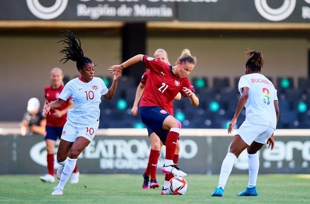 Ashley Lawrence of Canada competes for the ball with Franny Cerna of Czech Republic during the Women's International friendly match between Canada...