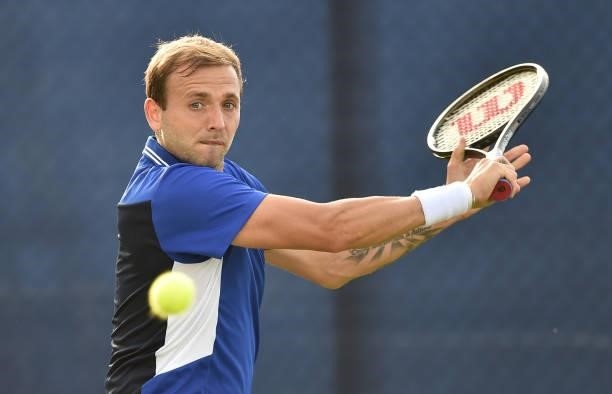 Daniel Evans of Great Britain plays a backhand shot against Denis Kudla of United States during the men’s singles match on day seven at Nottingham...