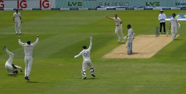 Stuart Broad celebrates after Zac Crawley claims a catch from the bat of Devon Conway of New Zealand but the third umpire ruled the ball had hit the...