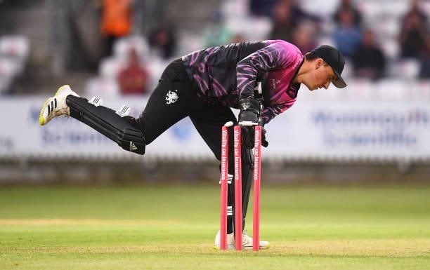 Tom Banton of Somerset removes the bails during the Vitality T20 Blast match between Somerset and Surrey at The Cooper Associates County Ground on...