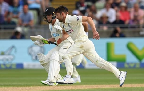 Mark Wood of England races Will Young of New Zealand to the ball during the second day of the second LV= Test Match between England and New Zealand...