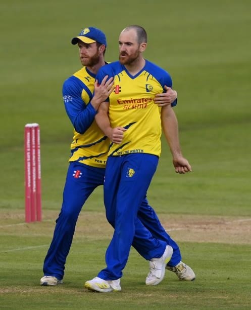 Durham bowler Ben Raine celebrates with Graham Clark after taking the wicket of Tom Kohler-Cadmore during the Vitality T20 Blast match between Durham...