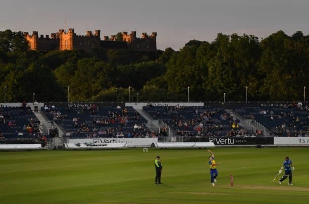 Durham bowler Matthew Potts bowls as the late evening sun hits Lumley Castle during the Vitality T20 Blast match between Durham Cricket and Yorkshire...