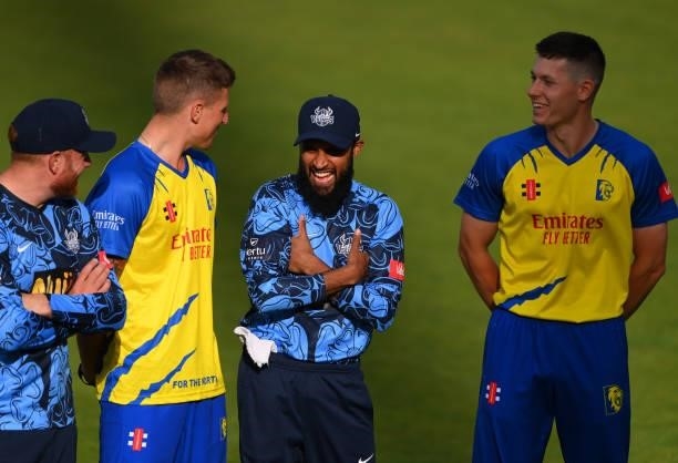 Yorkshire bowler Adil Rashid shares a joke with Brydon Carse of Durham before the Vitality T20 Blast match between Durham Cricket and Yorkshire...