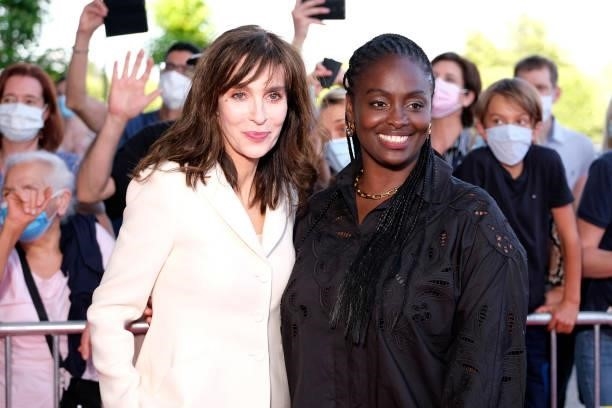 President of Jury Emergence Actress Anne Parillaud and President of Jury International Aïssa Maîga pose on the red carpet during the opening ceremony...