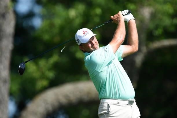 Retief Goosen of South Africa hits his tee shot on the second hole during the first round of the American Family Insurance Championship at University...