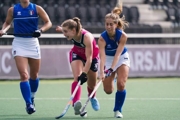 Charlotte Watson of Scotland battles for possession with Ailin Oviedo during the Euro Hockey Championships match between Scotland and Italy at...