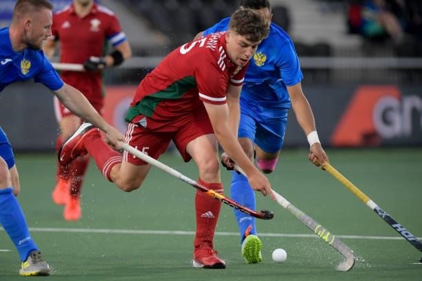 Rhys Bradshaw of Wales, Linar Fattakhov of Russia during the Euro Hockey Championships Men match between Wales and Russia at Wagener Stadion on June...