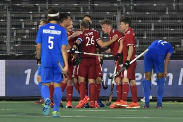 Luke Hawker of Wales celebrates with his teammates during the Euro Hockey Championships Men match between Wales and Russia at Wagener Stadion on June...