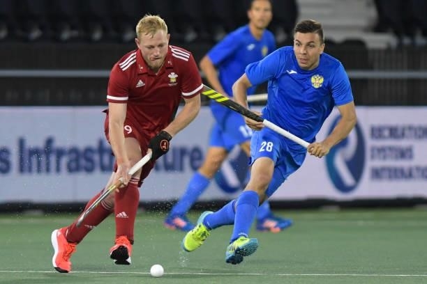 Rupert Shipperley of Wales, Ilfat Zamalutdinov of Russia during the Euro Hockey Championships Men match between Wales and Russia at Wagener Stadion...