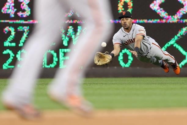 LaMonte Wade Jr of the San Francisco Giants makes a catch against the Washington Nationals during the second inning at Nationals Park on June 11,...