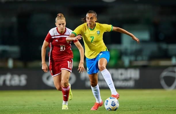 Andressa Silva of Brazil competes for the ball with Nadezhda Smirnova of Russia during the Women's International friendly match between Brazil and...