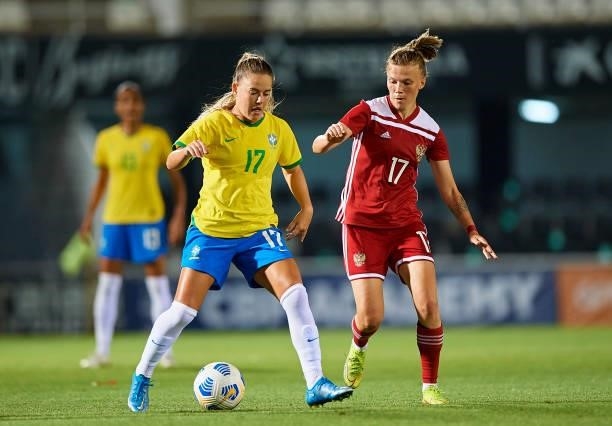Andressa Machry of Brazil competes for the ball with Ekaterina Pantukhina of Russia during the Women's International friendly match between Brazil...