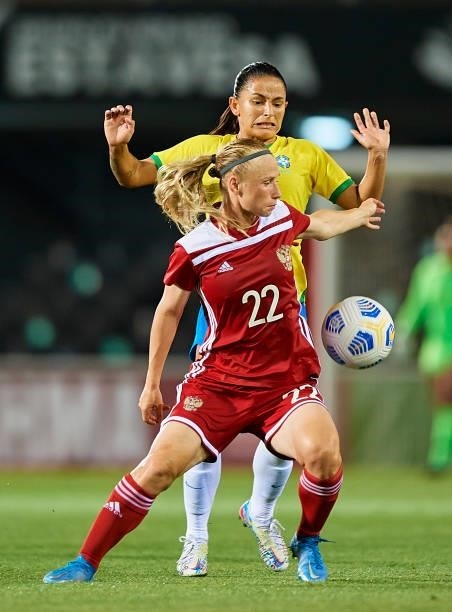 Debora Oliveira of Brazil competes for the ball with Victoria Kozlova of Russia during the Women's International friendly match between Brazil and...