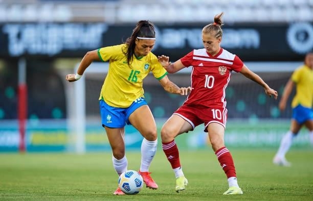 Beatriz Joao of Brazil competes for the ball with Nadezhda Smirnova of Russia during the Women's International friendly match between Brazil and...